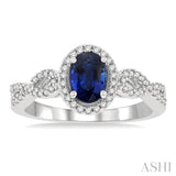 7x5 MM Oval Cut Sapphire and 1/5 ctw Twisted Split Shank Round Cut Diamond Precious Ring in 14K White Gold