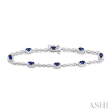 5x3 MM Oval Cut Sapphire and 1/20 Ctw Single Cut Diamond Bracelet in 10K White Gold